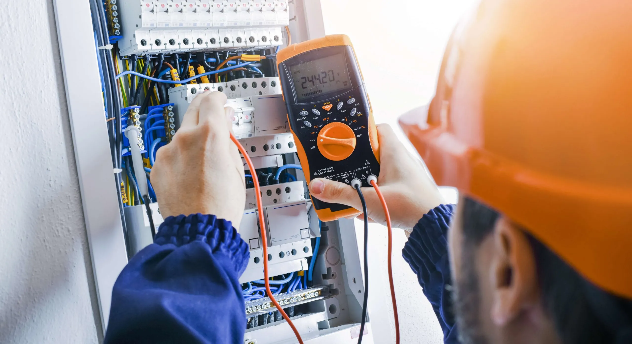 Technician working on electrical equipment
